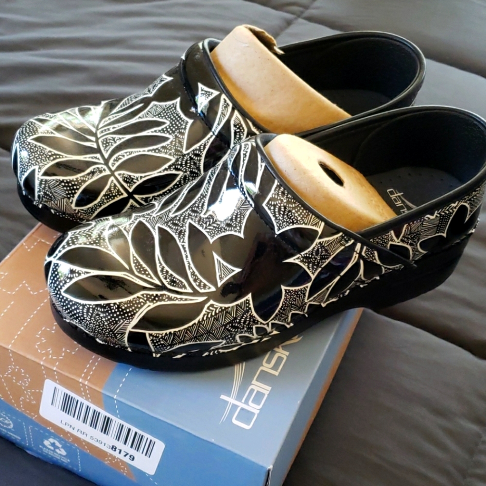 Dansko Black and White Floral Patent Leather Clogs